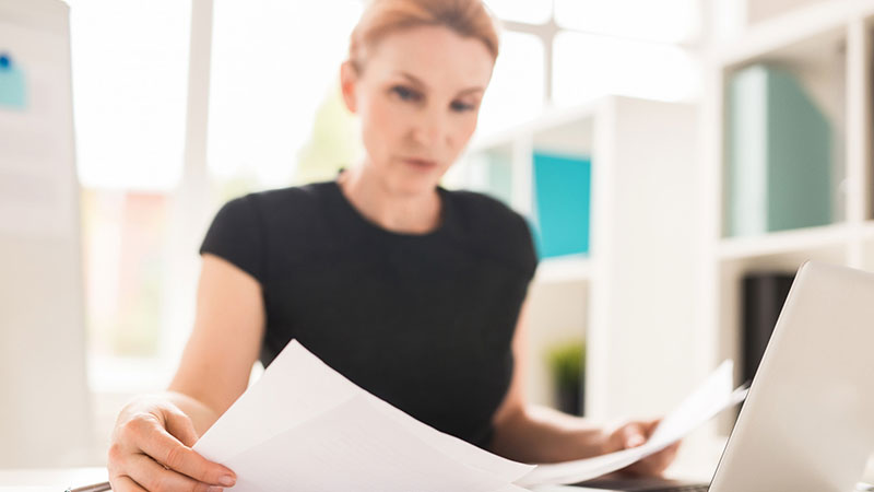 Professional person preparing a report