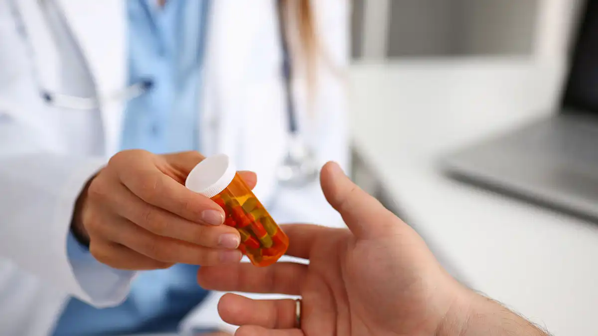 medication-blog-jul26 Doctor handing a patient medication