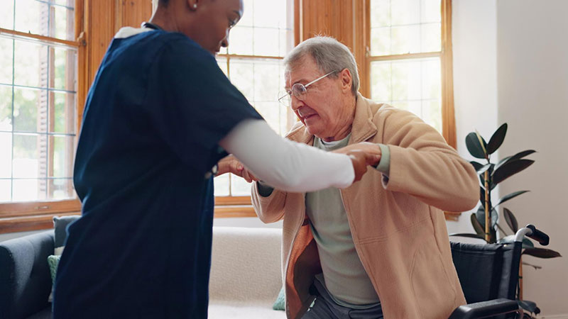 patient-handling Nurse handling a patient